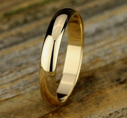 The Oro 18K Yellow Gold Wedding Band with Domed Polished Finish 4mm Forged Union