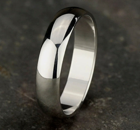 The Aure 18K White Gold Wedding Band with Domed Polished Finish 5mm Forged Union