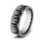 A 7mm wide tungsten carbide ring with a brushed matte finish featuring an engraved evergreen treeline scene.