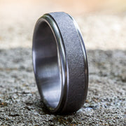 The Ezra Grey Tantalum Swirl Center High-Polish Edge Wedding Band 6.5mm Forged Union